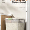 A transparent airtight food storage barrel filled with rice, displayed on a kitchen counter.