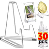 Clear acrylic display stands for collectibles including a gold medal and various clear acrylic holders.