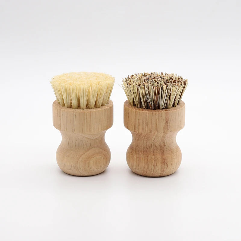 A set of two bamboo dish scrub brushes with sisal bristles, showing light yellow and brown natural fibers.