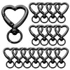 A set of black heart-shaped spring hook keychains.