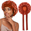 A woman wearing a satin sleeping cap with an adjustable tie band in a burnt orange color.