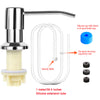 A silver under-sink kitchen soap dispenser with a silicone extension tube and gravity balls.