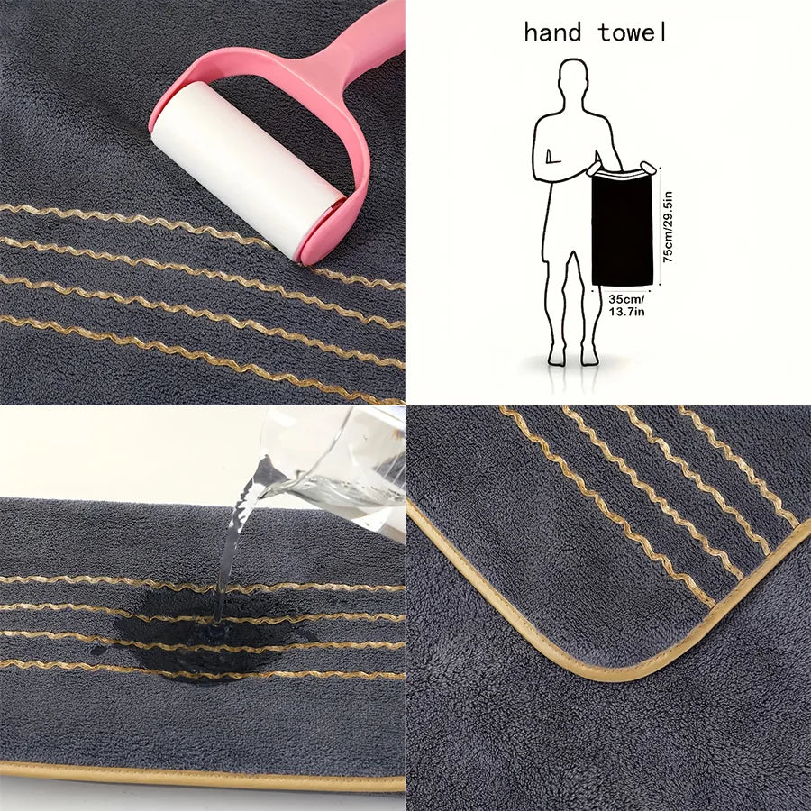 A hand towel product featuring a rolled white towel and a black book illustration on a dark gray fabric with gold stripes.