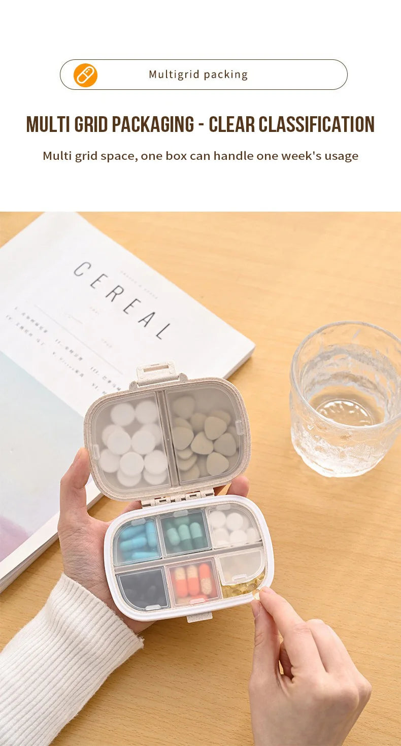 A hand holds an open multi grid portable pill organizer showing various colored pills and capsules.