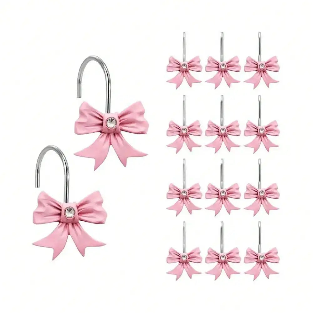 A set of twelve pink decorative bow tie shower curtain hooks.