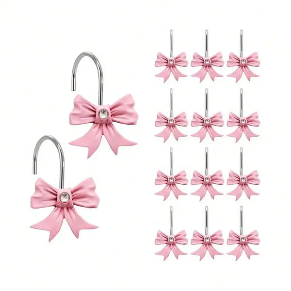 A set of twelve pink decorative bow tie shower curtain hooks.