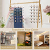 Adjustable pants hangers with swivel clips hanging on a wooden rack for closet organization