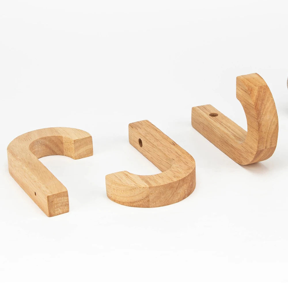 Three natural oak wood wall hooks with screws shown in various angles