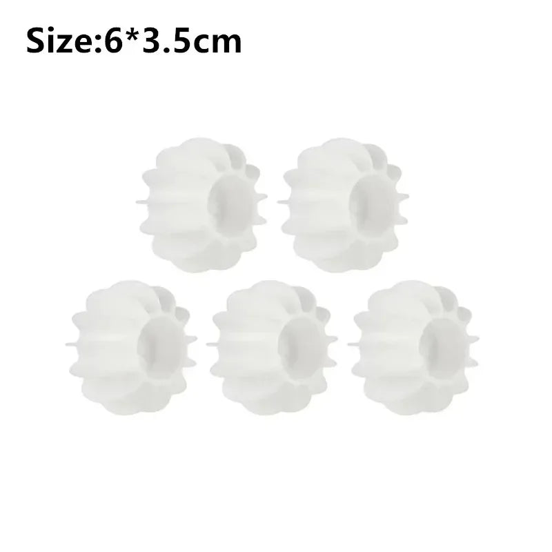 Six white reusable laundry balls designed for pet hair and lint removal.