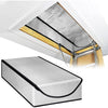 A silver attic heat and dust barrier panel installed under a white roof overhang.