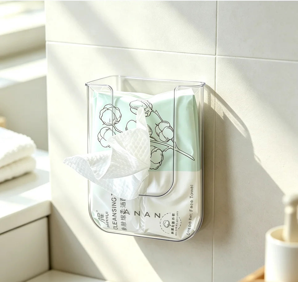 A clear plastic container holds several white disposable cotton face towels for makeup and cleansing.