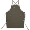 A dark olive green adjustable hairdressing apron with straps and pockets.
