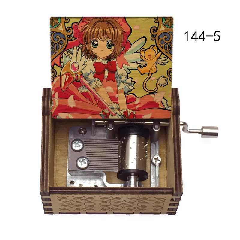 A musical tone box featuring an anime-style illustration of a girl with red hair and wings, packaged in a wooden box.