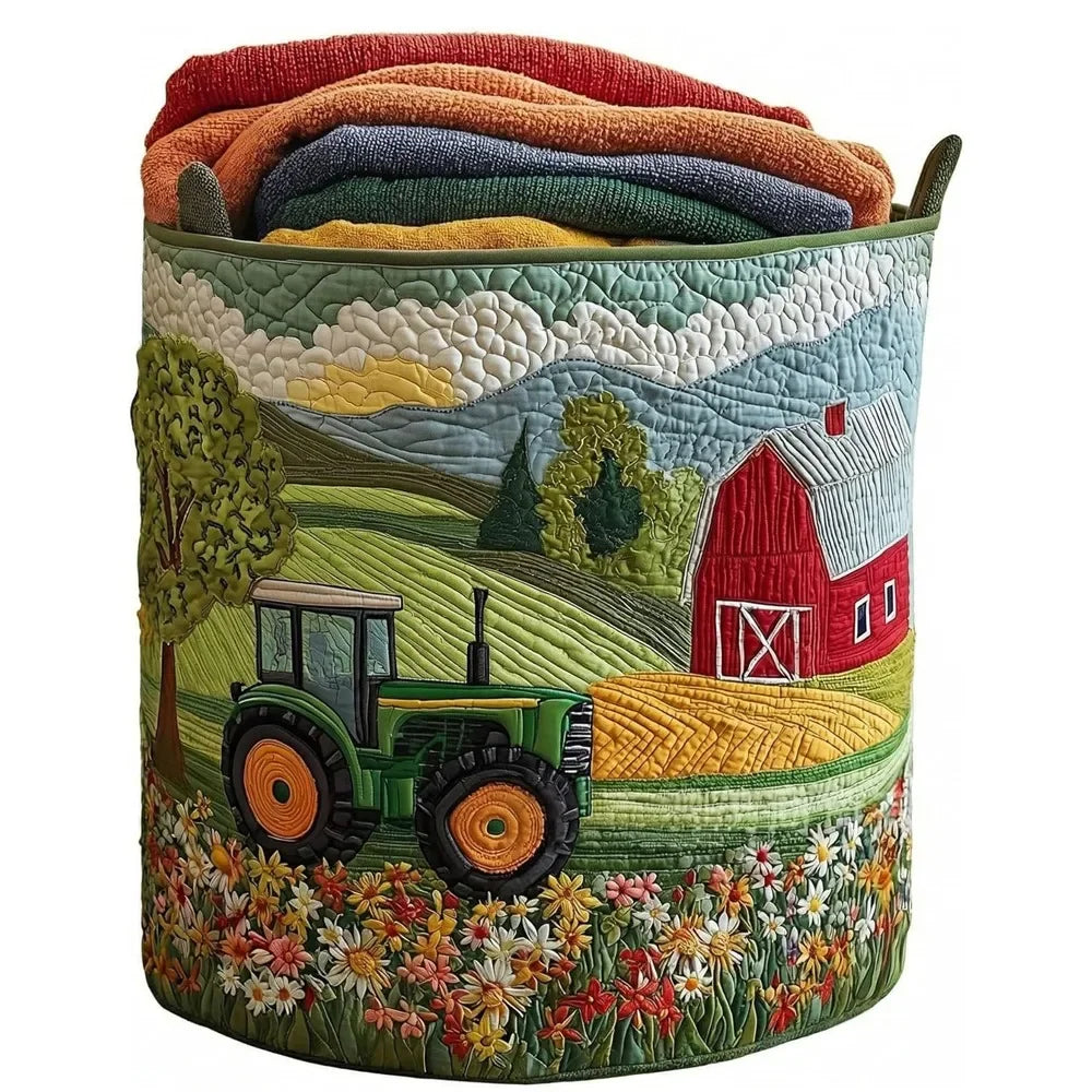 A quilted laundry basket filled with folded colorful textiles, featuring a rural scene of a red barn and a green tractor.