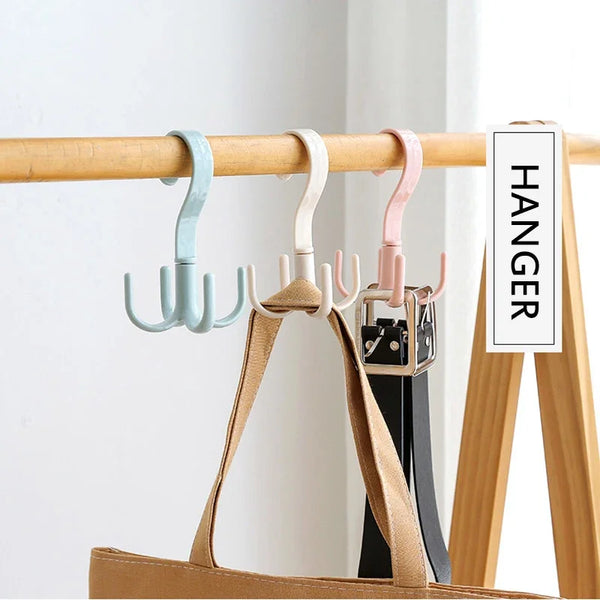 A set of wooden hangers with various colored plastic and metal hooks displayed on a wooden rack.