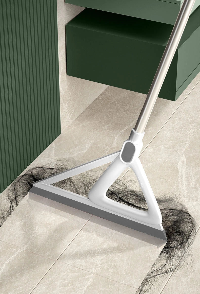 A white silicone window and surface cleaner is shown cleaning a light-colored tile floor next to a dark green cabinet.