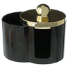 Black plastic bathroom organizer with a gold-colored lid for storing cotton swabs and makeup accessories