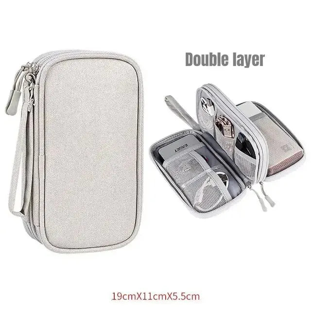 A light gray double layer portable storage organizer pouch with a zippered compartment.