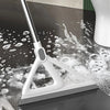 A white silicone window and surface cleaner is shown cleaning a dark surface with soapy water.