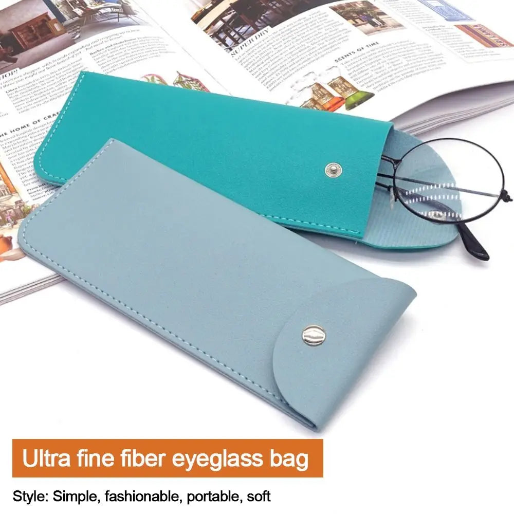 A teal and light blue PU leather fiberglass eyeglass bag shown with a magnifying glass.