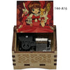 A wooden box containing a musical tone box with a character illustration on the lid.
