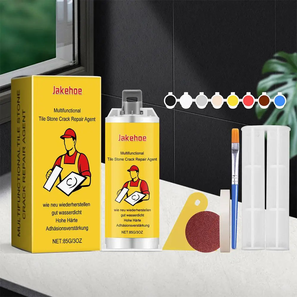 A yellow box and a spray bottle of Jakehoe multifunctional tile stone crack repair agent are displayed on a table.