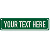 A rectangular green metal door sign with the text YOUR TEXT HERE in white capital letters.