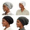 A collection of adjustable silk-lined night caps in gray and black shown on models.