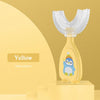 Yellow penguin shaped silicone toothbrush for kids displayed on a yellow stand.
