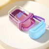 A purple leakproof travel container is shown with a light blue silicone accessory on a white surface.