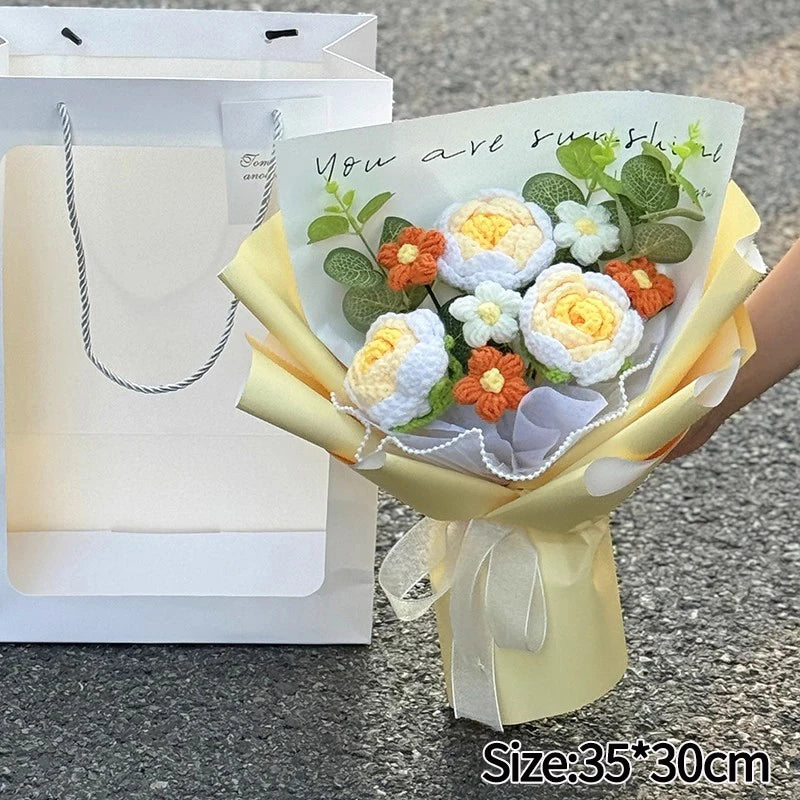 A yellow bouquet of handmade crochet flowers with a sign that reads You are sunshine