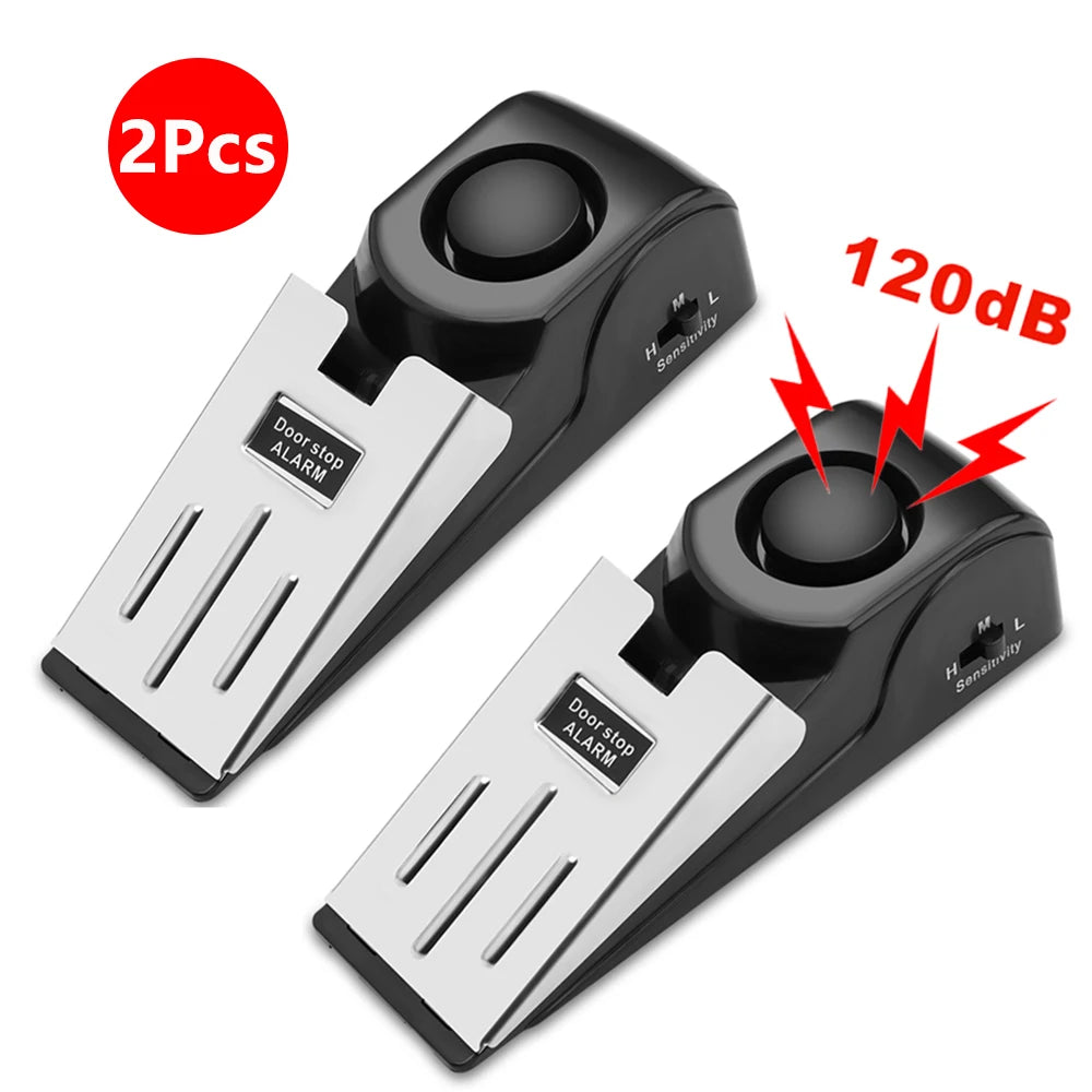 Dos topes de puerta portátiles negros con alarmas de vibración, mostrando un nivel de sonido de 120dB.