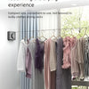 A new arrival clothesline featuring hangers and clothing displayed on a wire line indoors.