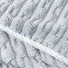 Close-up of a gray textured bath towel with diagonal stripes.