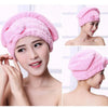 A woman models a pink microfiber hair drying towel cap, shown in close-up and full view.