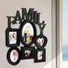 Décor mural en bois noir avec silhouette de famille et plusieurs portraits de famille encadrés