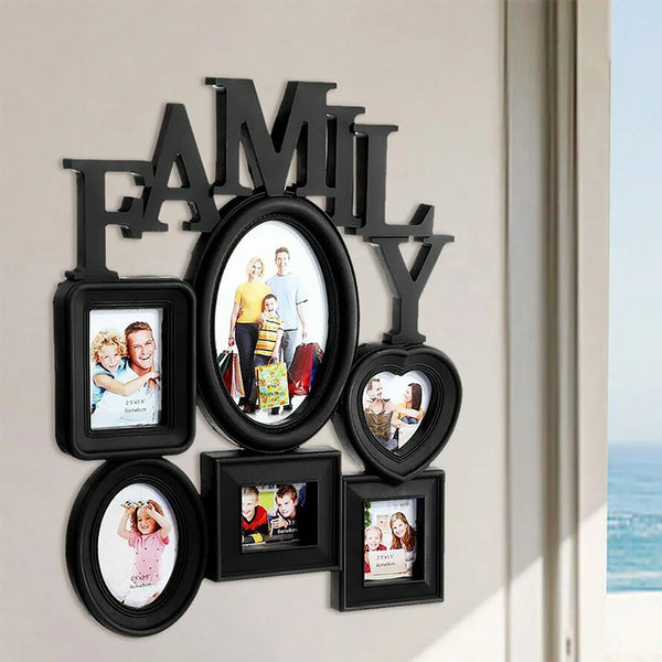Décor mural en bois noir avec silhouette de famille et plusieurs portraits de famille encadrés