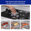 A set of multi-functional scratch-resistant cleaning cloths being used to wash vegetables under running water.