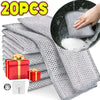 A stack of gray metal wire cleaning cloths and a hand pouring water into a circular cloth.