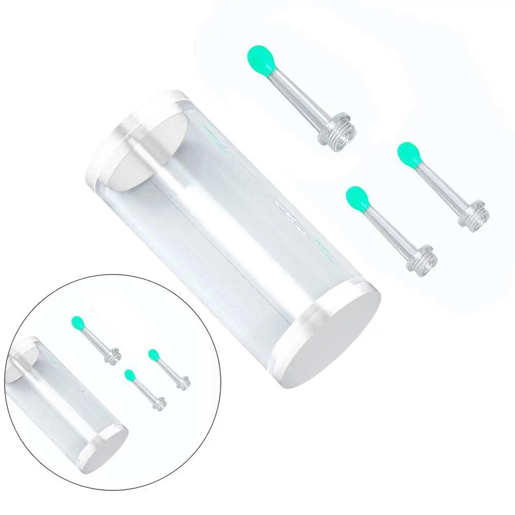 A clear plastic replacement ear spoon with green tips and metal attachments shown alongside several loose spoons.