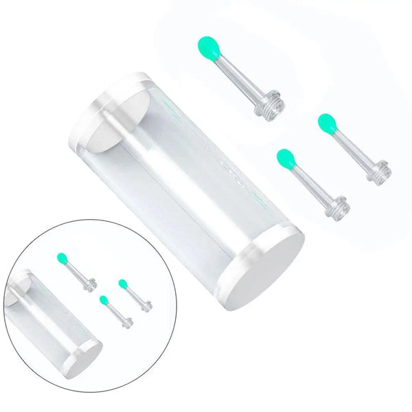A clear plastic replacement ear spoon with green tips and metal attachments shown alongside several loose spoons.