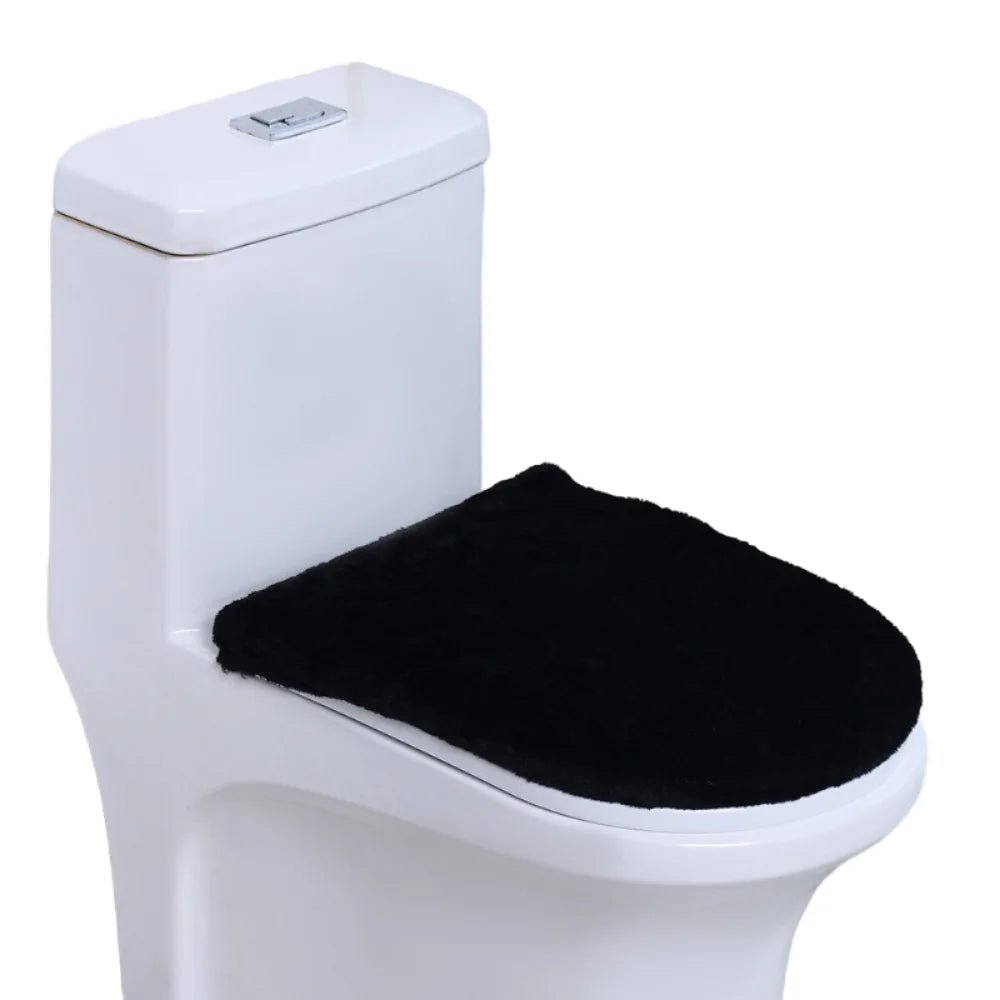 A white toilet with a black protective seat cover installed.