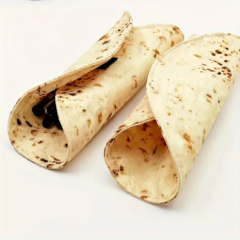 A light tan canvas pencil pouch featuring a unique burrito design pattern.
