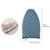 A blue quilted ironing pad with a diamond pattern shown next to a hand for scale.