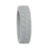 A close-up view of a light gray silicone luggage wheel protector.