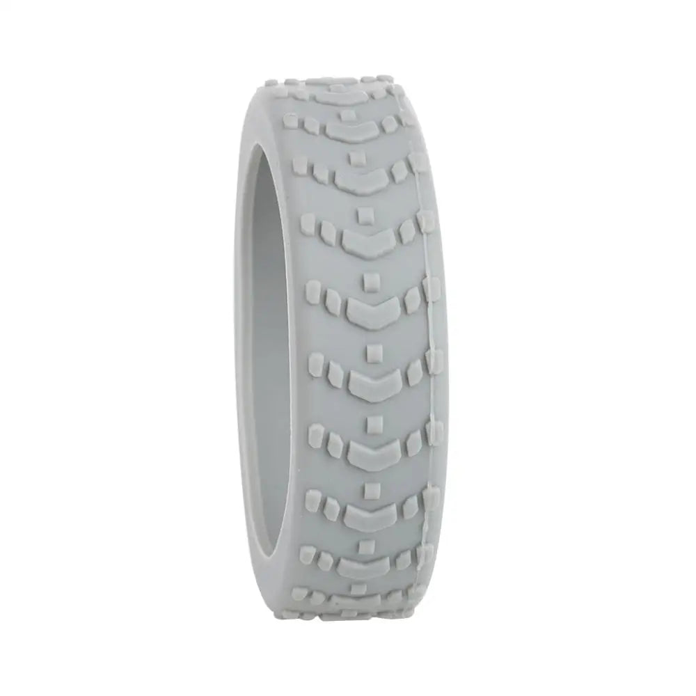 A close-up view of a light gray silicone luggage wheel protector.