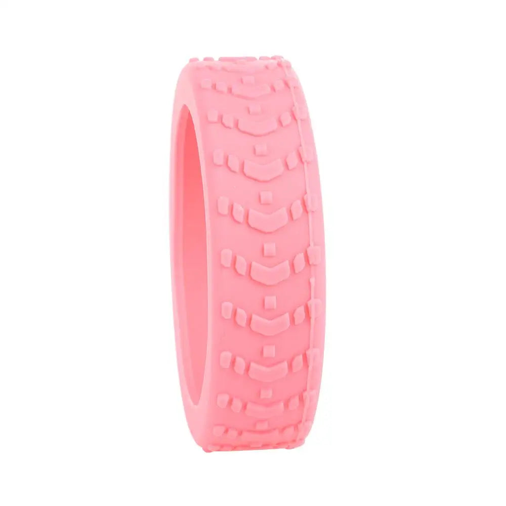 A pink silicone luggage wheel protector with a textured grip pattern.