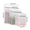 A set of five reusable mesh laundry bags in various sizes and colors displayed side by side.