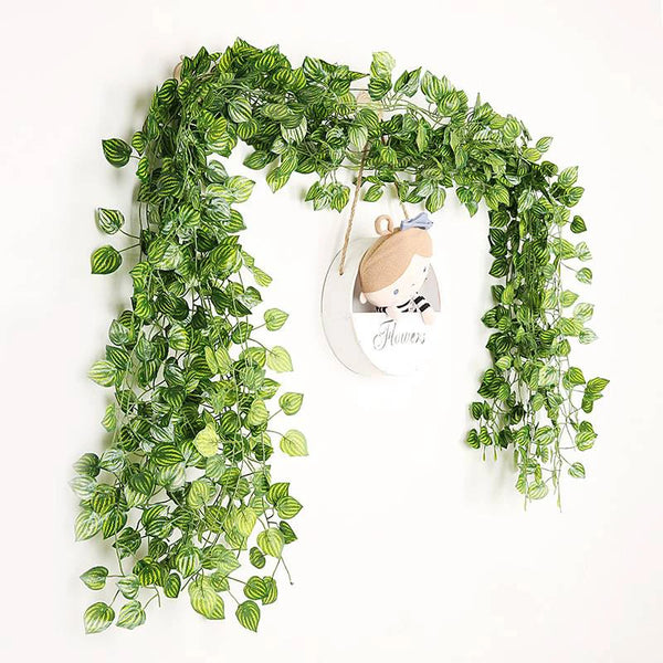 Artificial ivy green garland vine for home decor featuring lush green leaves and a small bear charm