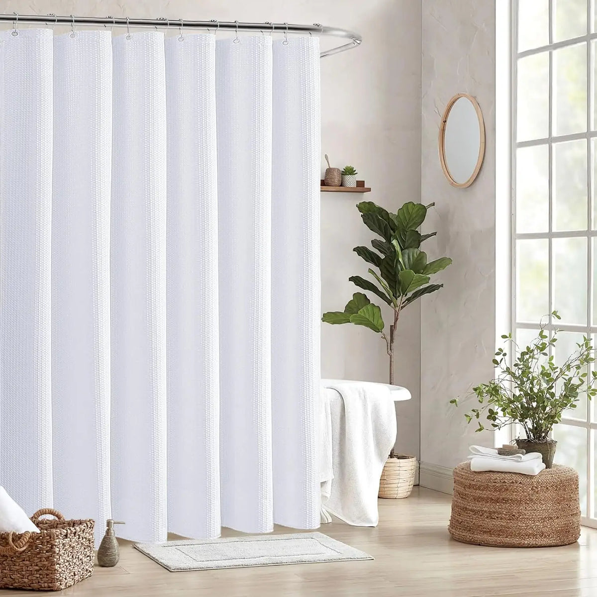 White waffle weave shower curtain hanging on a metal rod in a bathroom setting